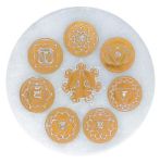 Bild von Selenit-Energiescheibe mit Chakrasymbolik gold Ø10cm