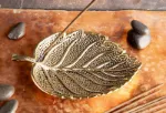 Bild von Stäbchenhalter Blatt, Bronze